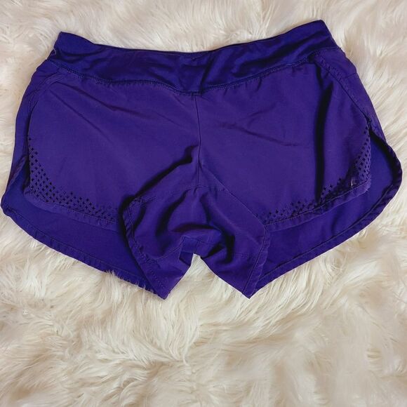 Athleta laser cutout hem purple 3" running shorts - Picture 1 of 10